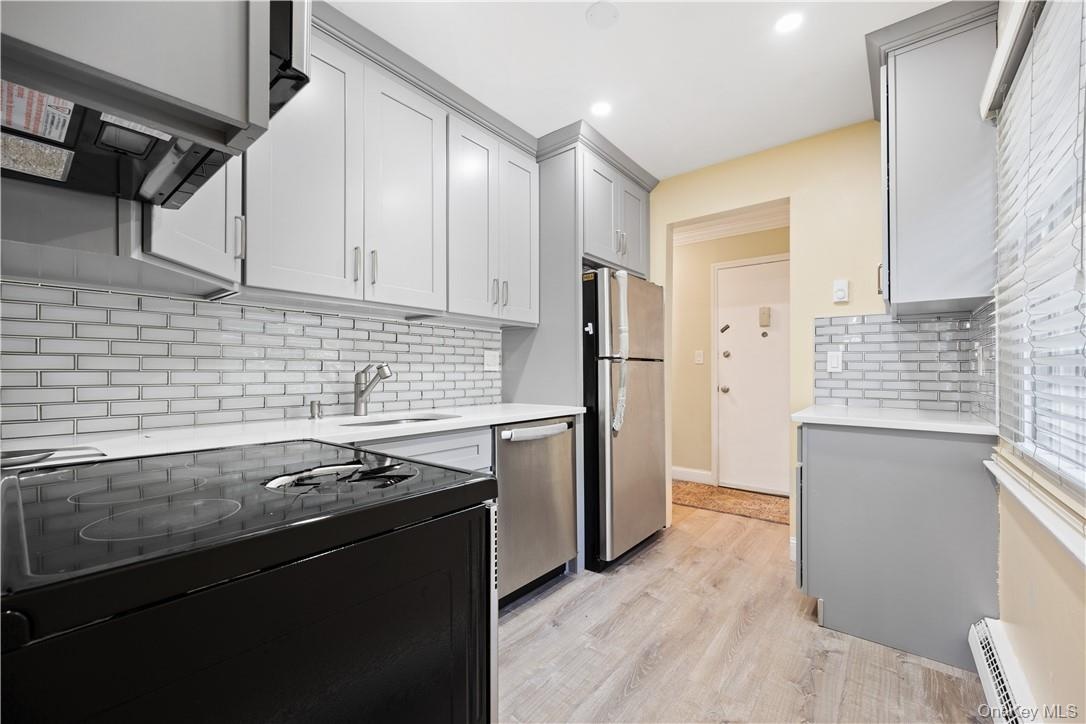 Kitchen has stainless steel appliances.