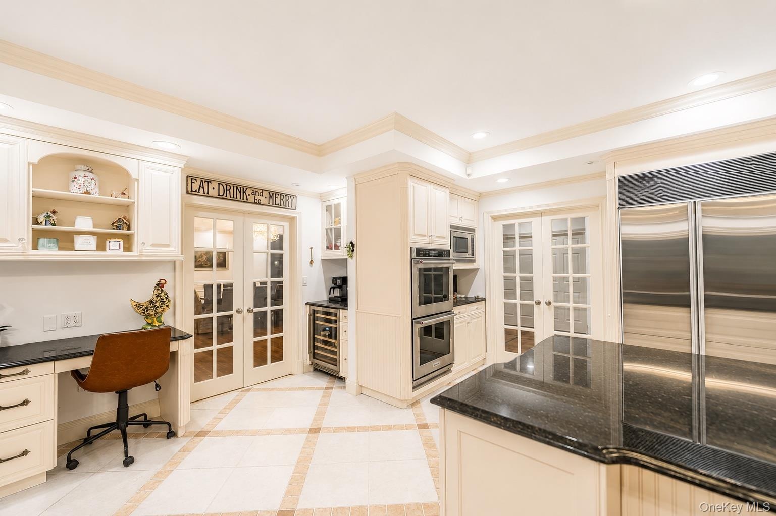 kitchen desk area , double ovens , coffee bar, wine refrigerator
