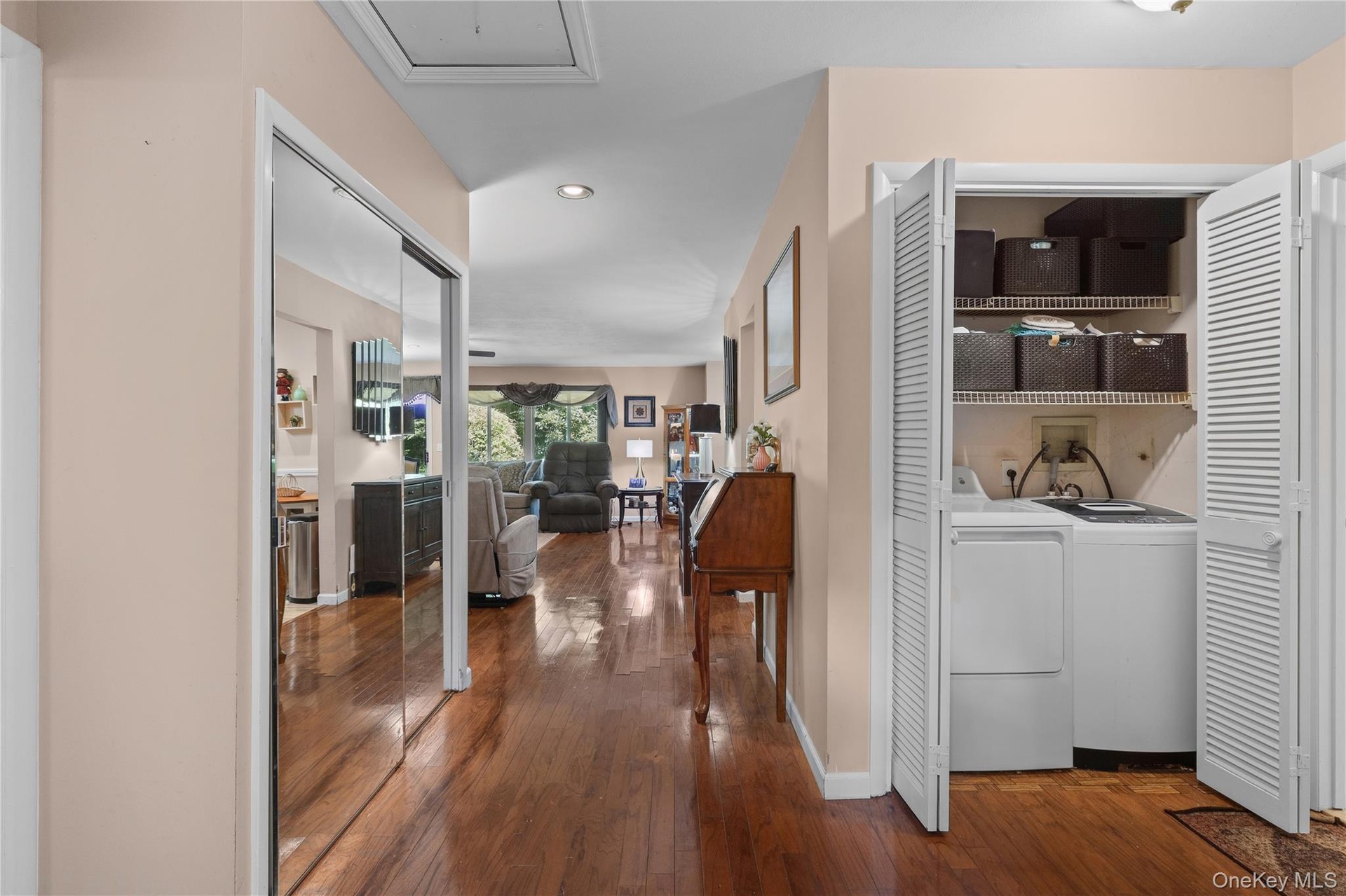 Entry hall with coat closet, double closet and separate side by side washer and dryer area