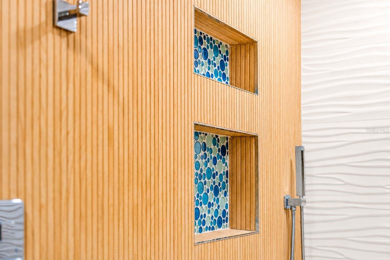 DESIGNER INLAYS SET INTO SHOWER WALL