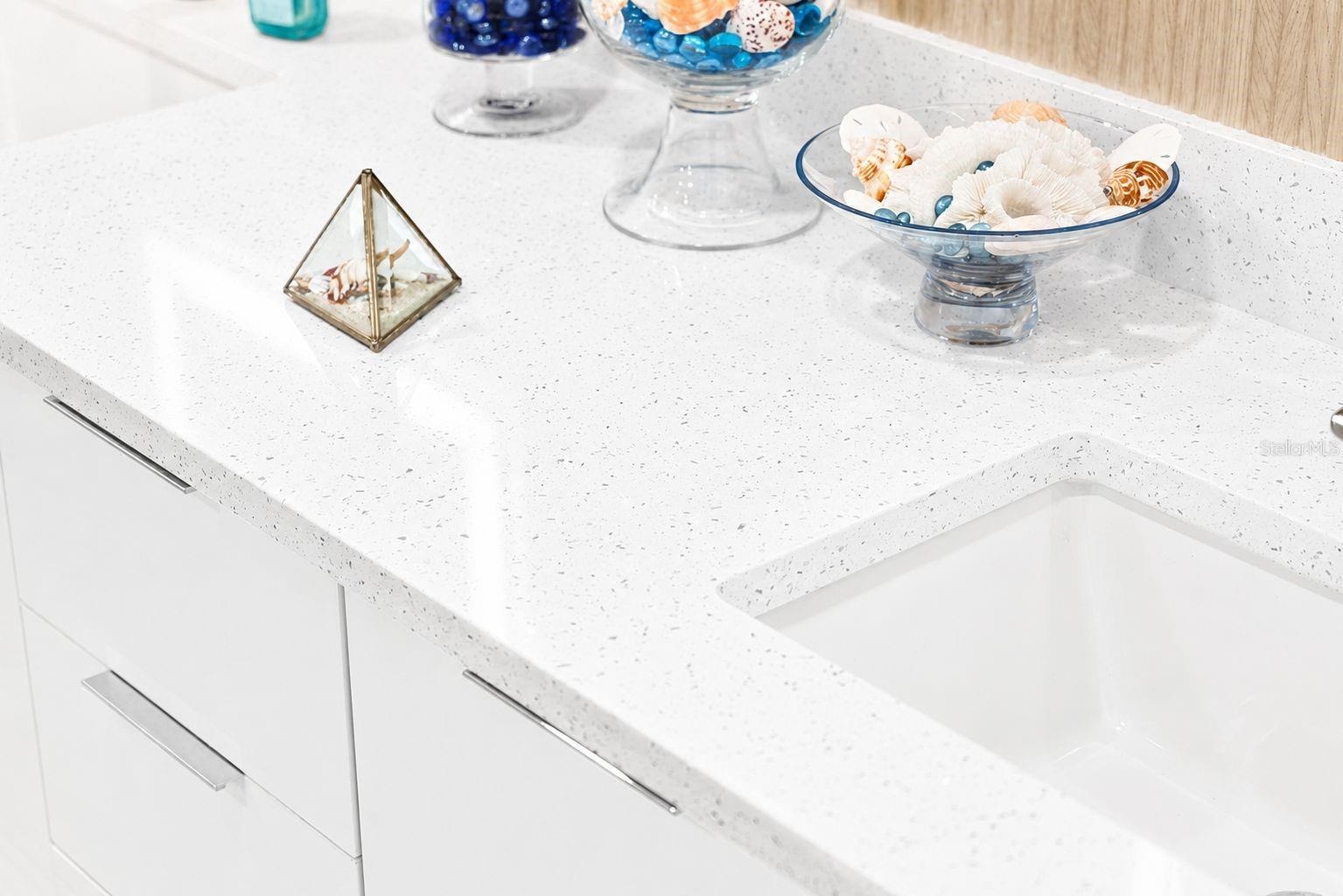 MATCHING QUARTZ COUNTER TOPS THROUGHOUT