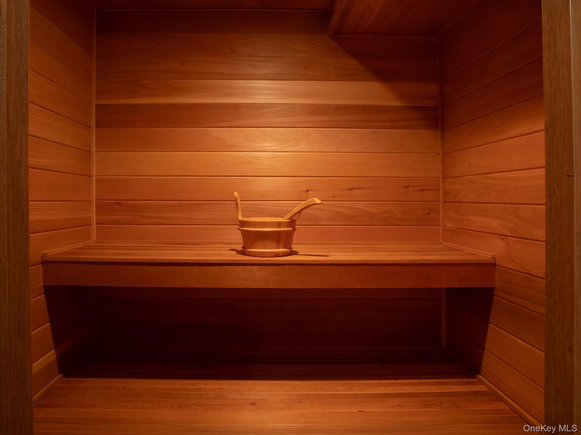 Relaxing sauna / steam room featuring wooden walls