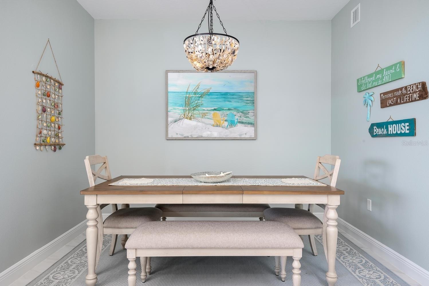 dining area with oyster chandelier