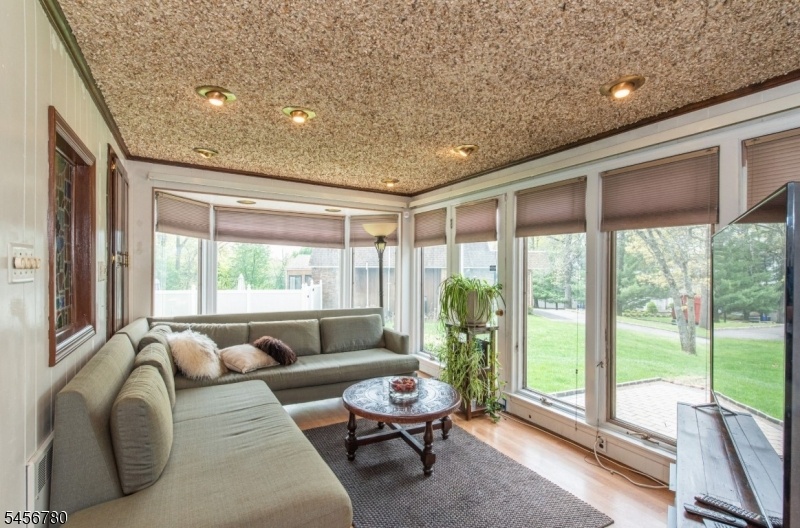 relaxing sunroom open to porch
