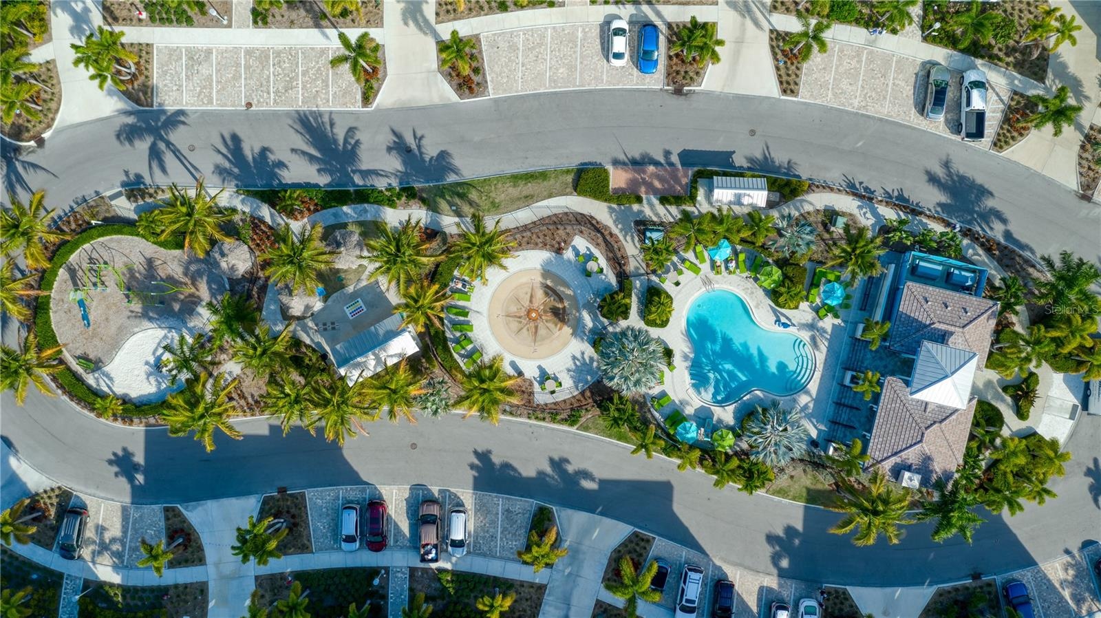aerial view of marina walk clubhouse, pool, splashed, playground, grilling, picnic and gathering area