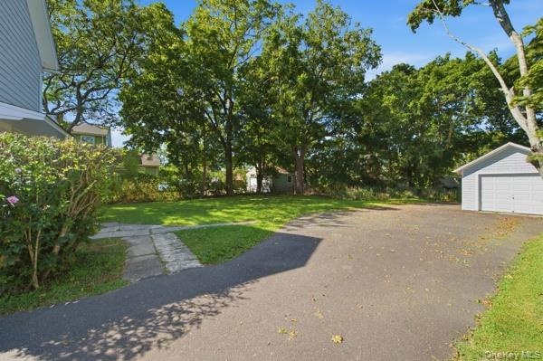 Paved driveway one car garage