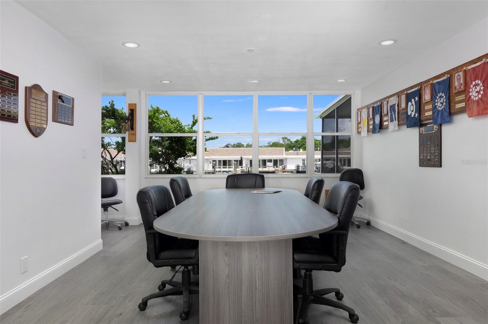 The community has 2 clubhouses. All have been renovated. This is one of the many areas where you can hold meetings. This Clubhouse is right on the wat