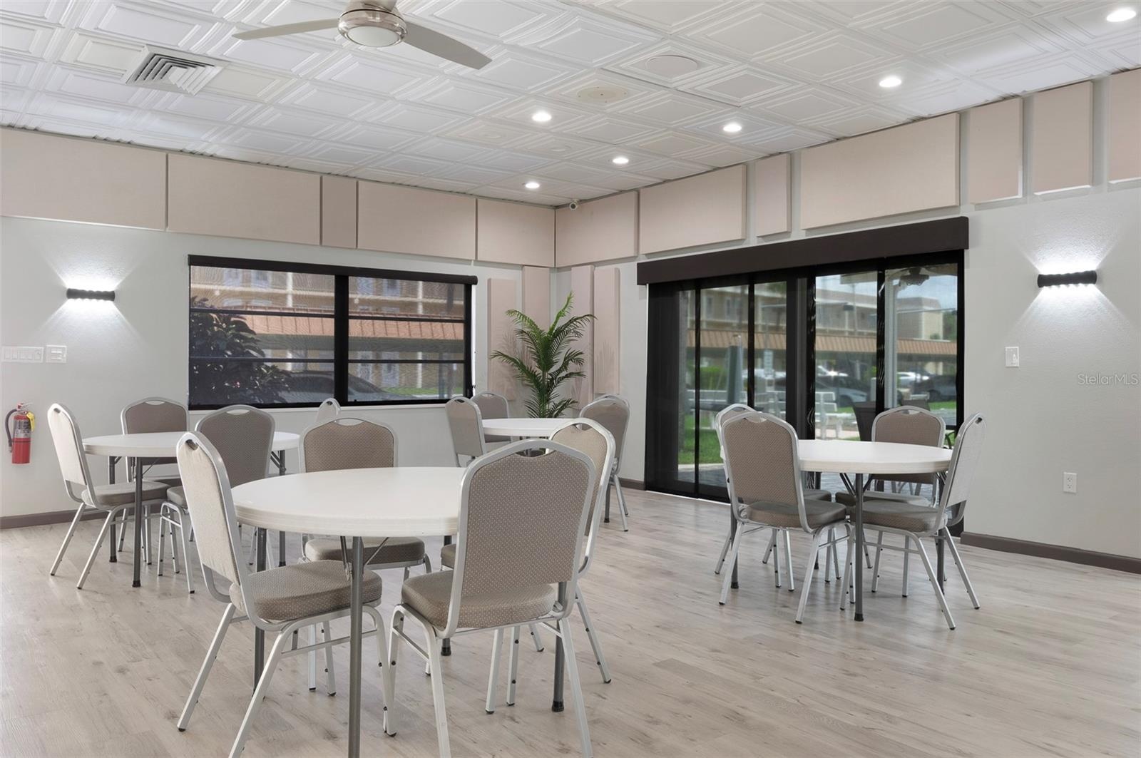 2nd Clubhouse set up for your games: Bridge, Mahjong, or just to socialize! Also, the outside patio area.