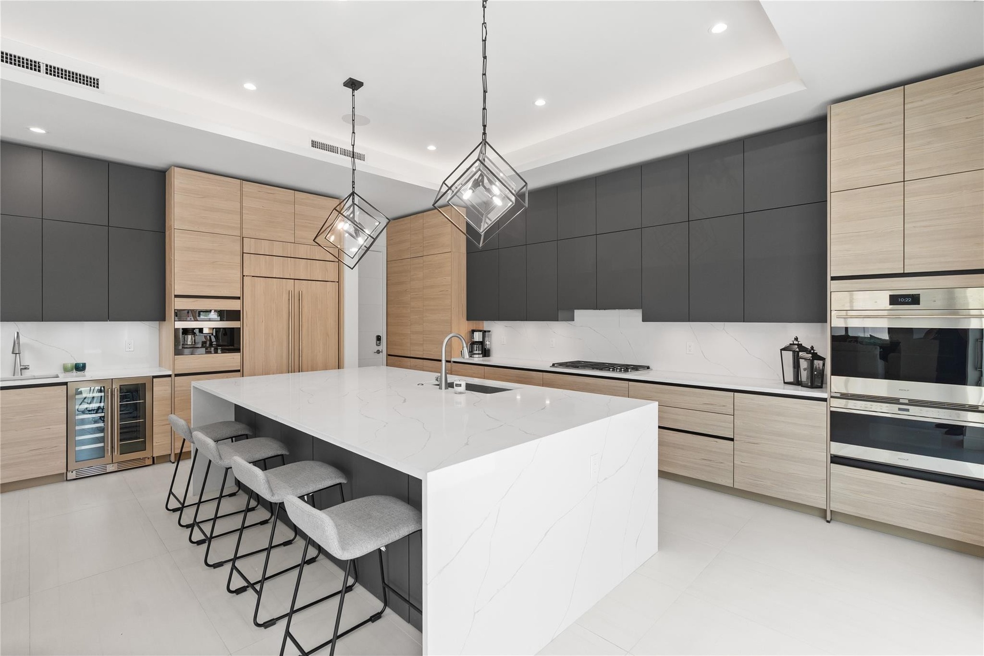 A custom designer kitchen with top of the line appliances, huge island, and tons of cabinetry storage. A remarkable luxury townhome rental that redefi