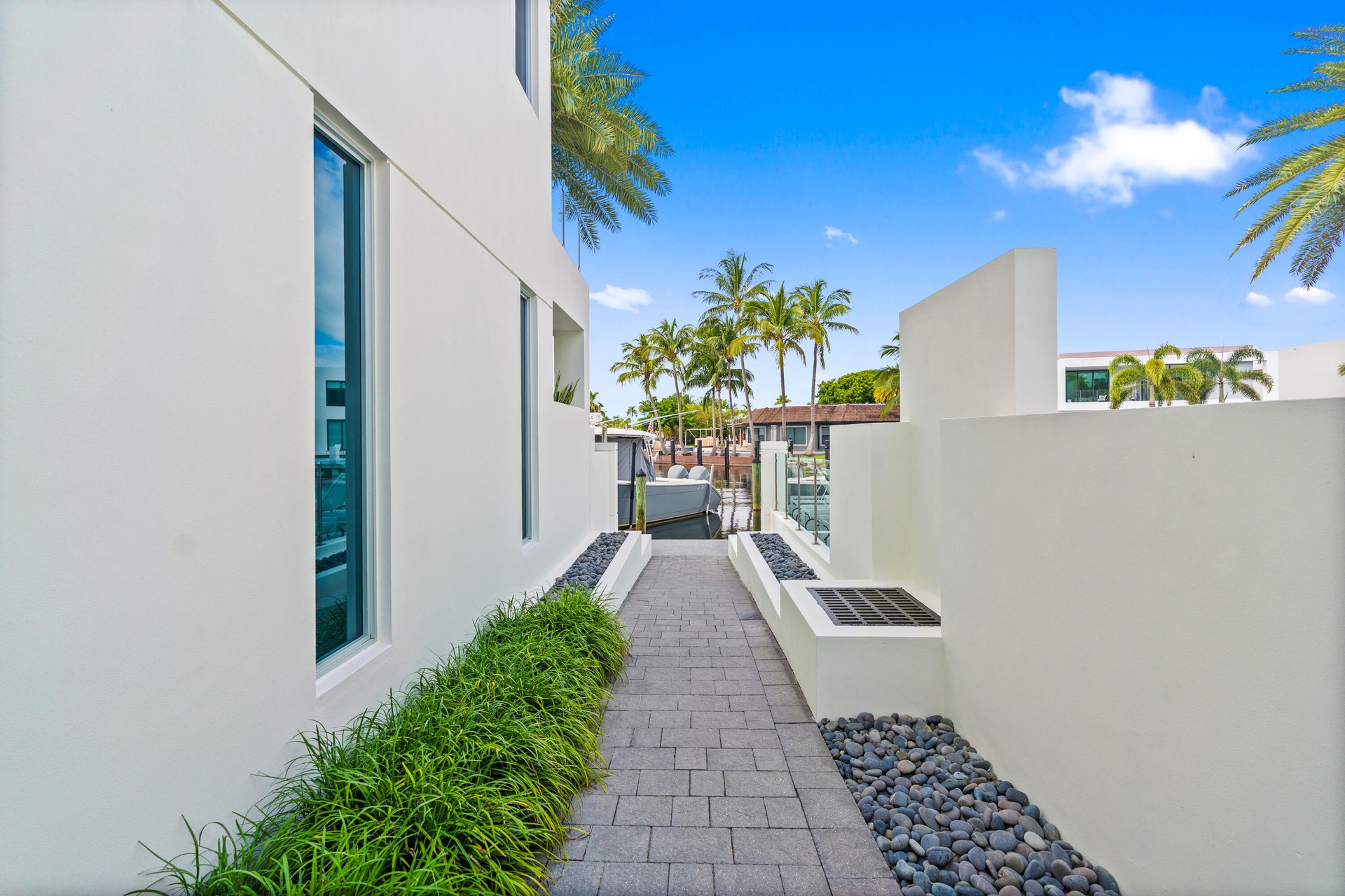 221 Shore Ct Community Pool Entry. A remarkable luxury townhome rental that redefines upscale living in the heart of Lauderdale By The Sea. This beaut