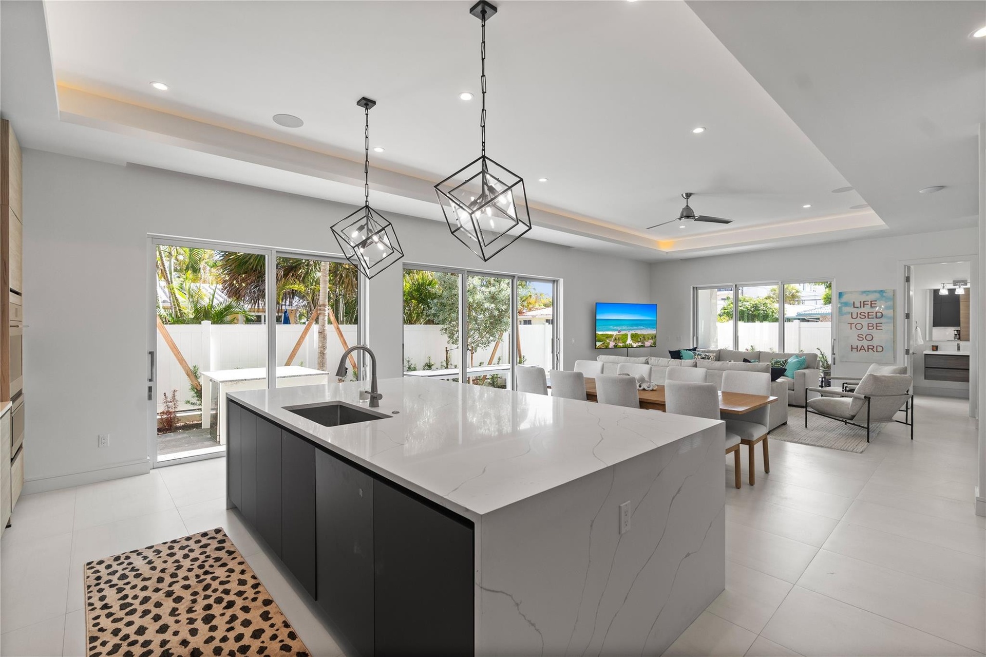Open concept living area and kitchen - A remarkable luxury townhome rental that redefines upscale living in the heart of Lauderdale By The Sea. This b