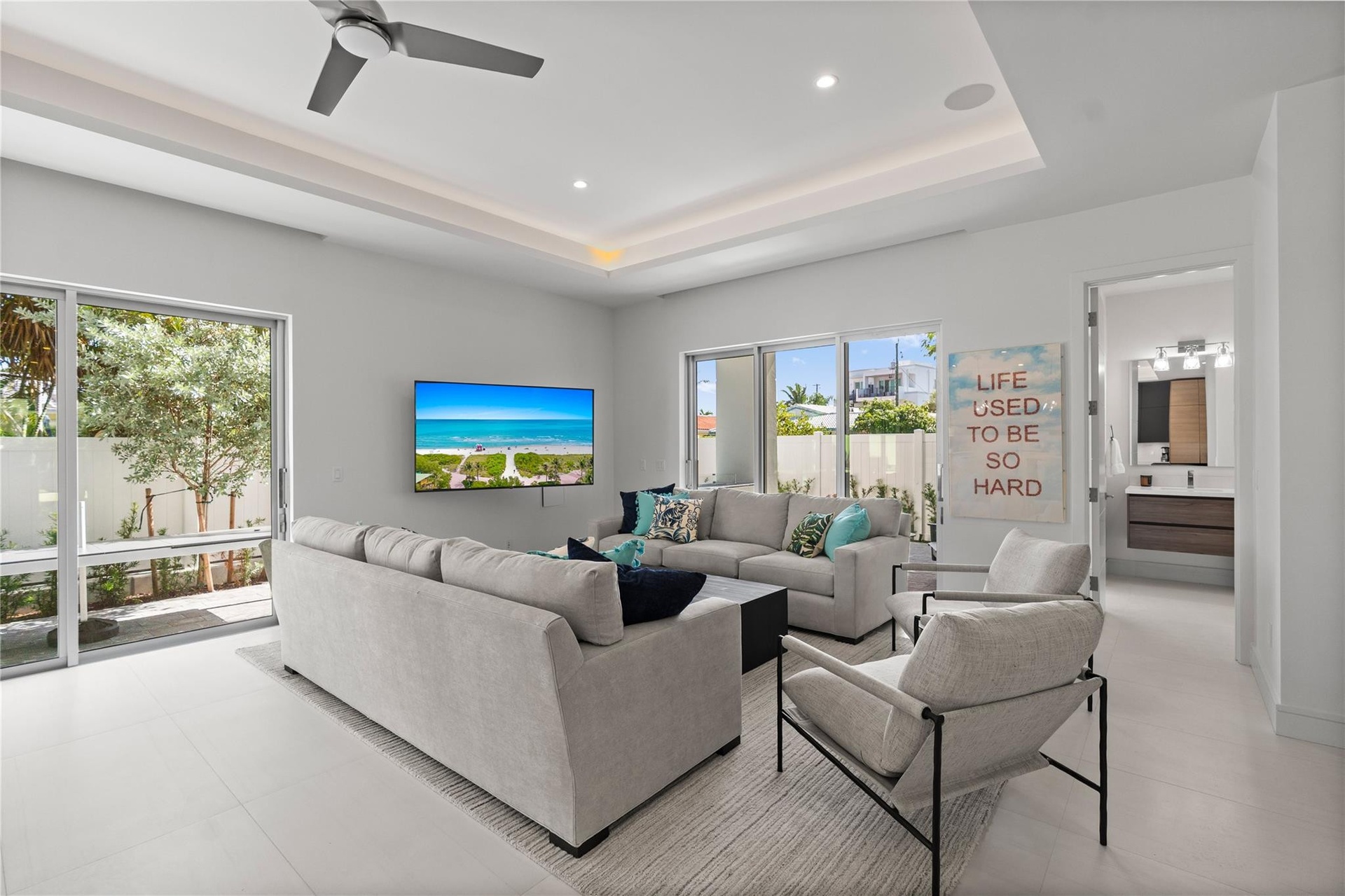 Open concept living area and kitchen - A remarkable luxury townhome rental that redefines upscale living in the heart of Lauderdale By The Sea. This b