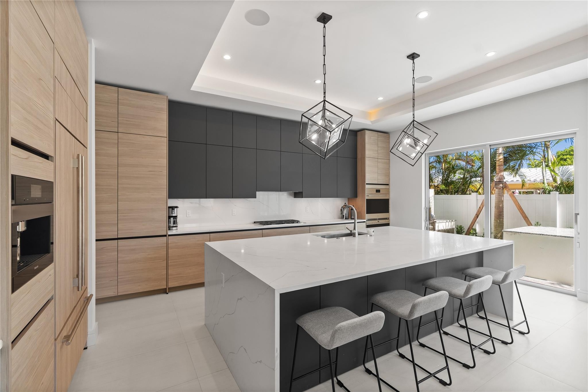 A custom designer kitchen with top of the line appliances, huge island, and tons of cabinetry storage. A remarkable luxury townhome rental that redefi