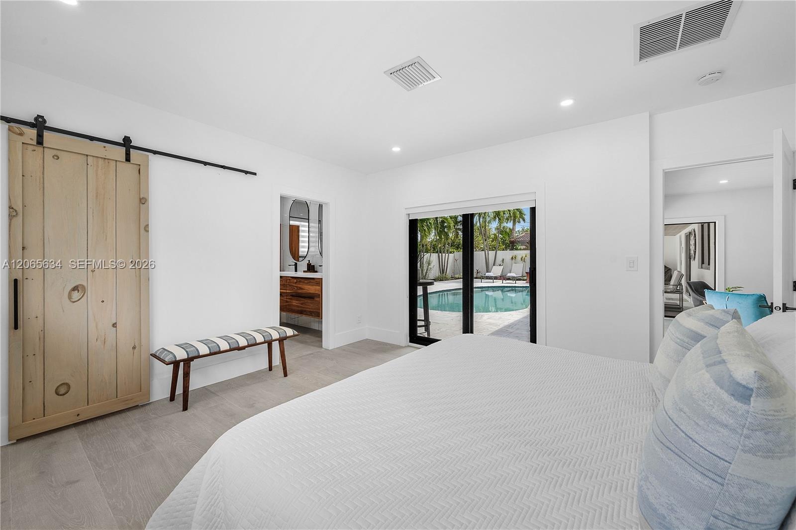 LARGE MAIN BEDROOM WITH SLIDING BARN DOOR