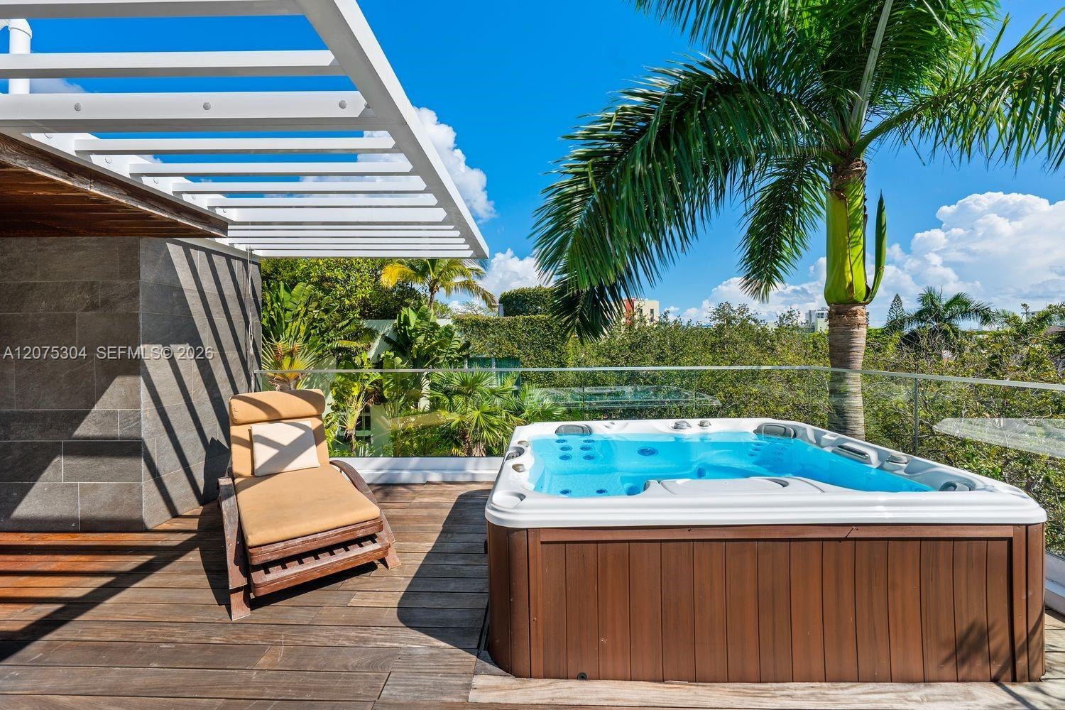 Private hot-tub area with shaded seating — perfect for evening relaxation and entertaining guests outdoors.