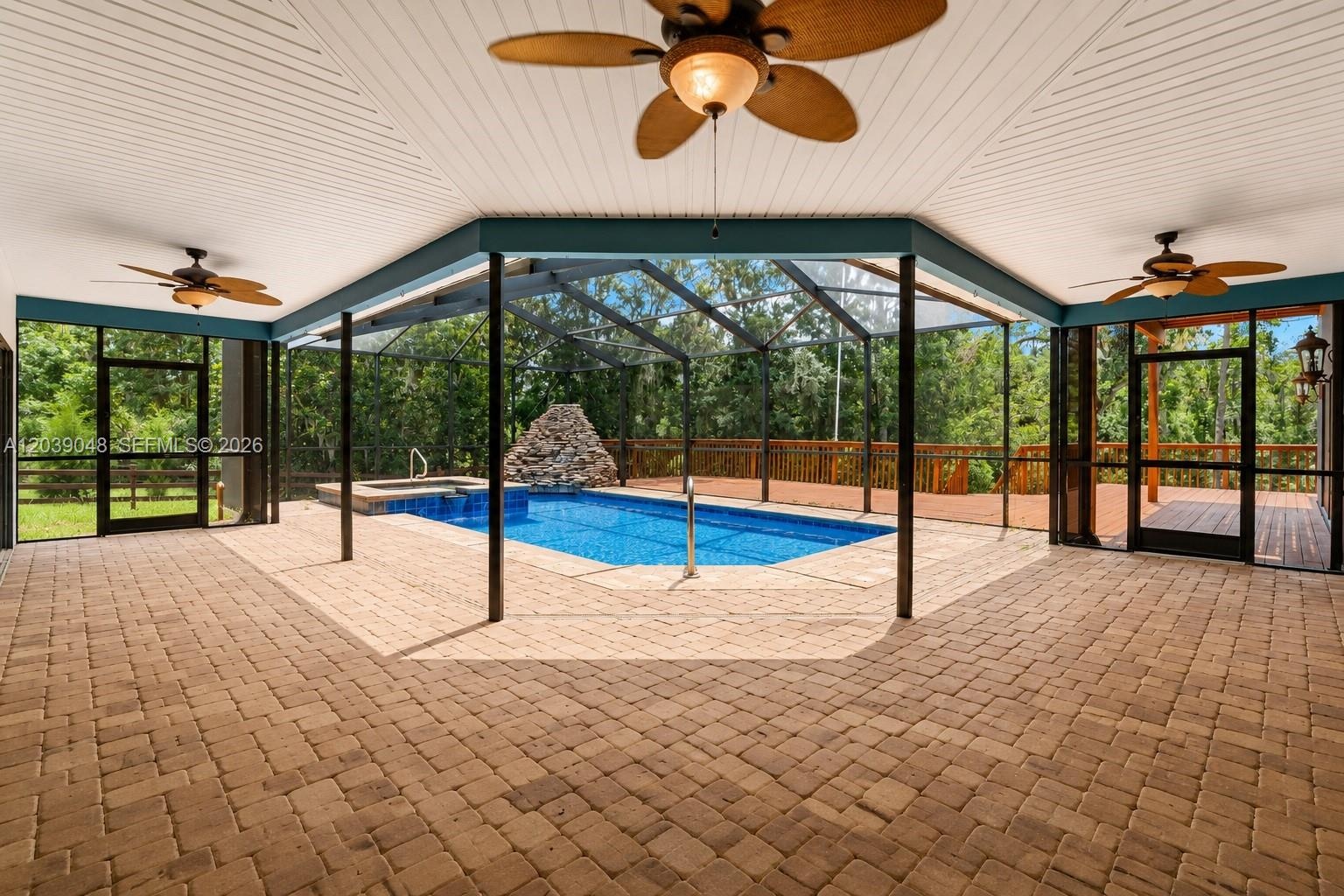 Functional pool and spa setup presenting opportunity for renovation, enhancement, or repositioning as a key lifestyle feature.