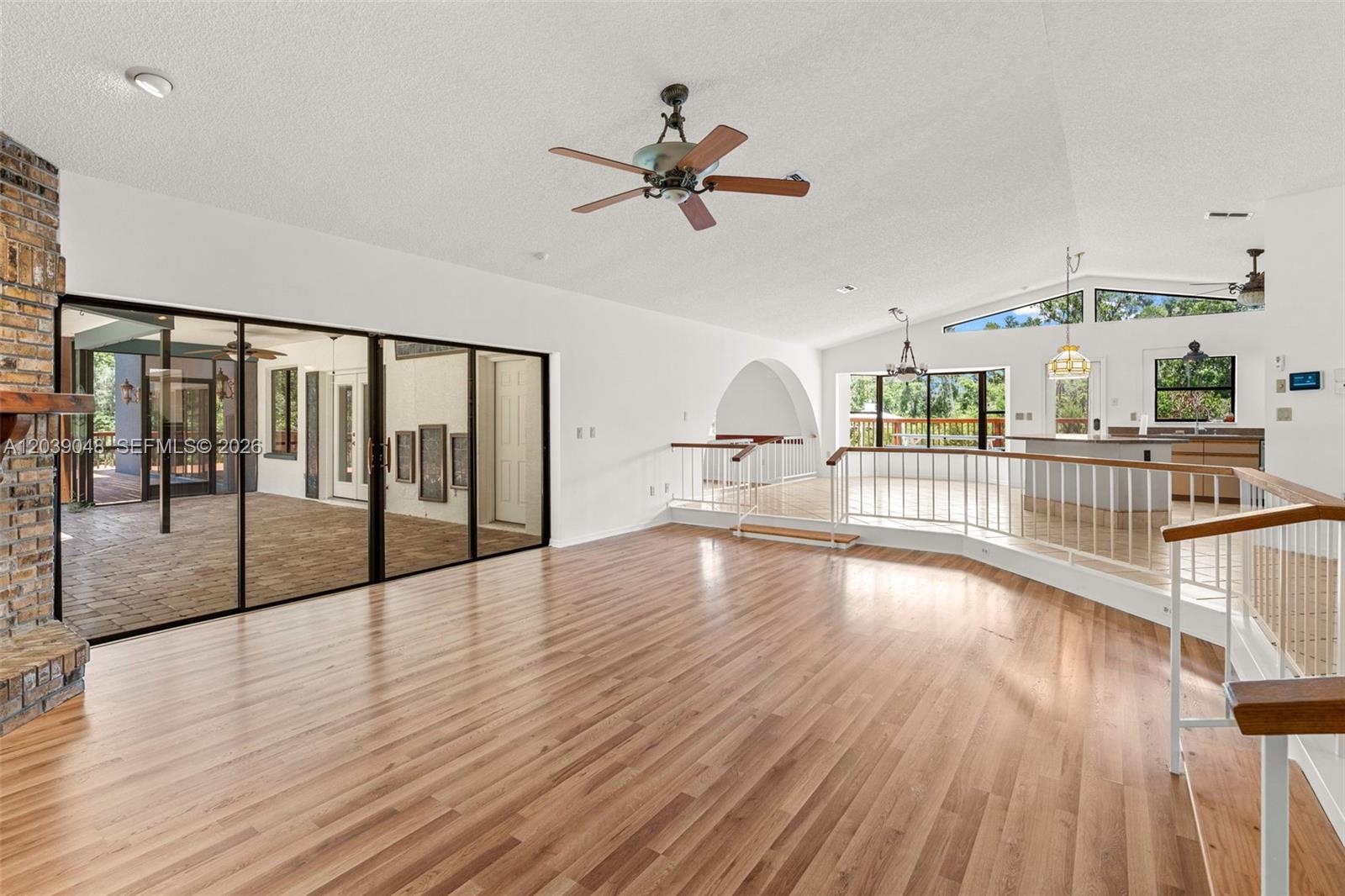 Spacious living room highlighted by a fireplace feature, offering a natural gathering point within the home’s open and functional layout.