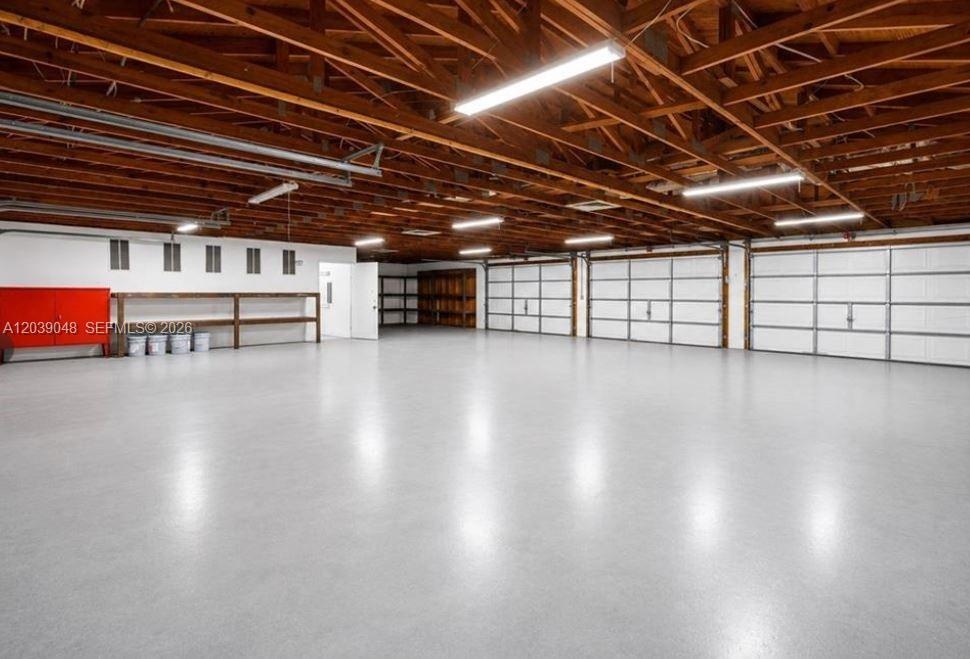 Large-scale garage structure designed for heavy storage, hobby use, or potential business-related applications.