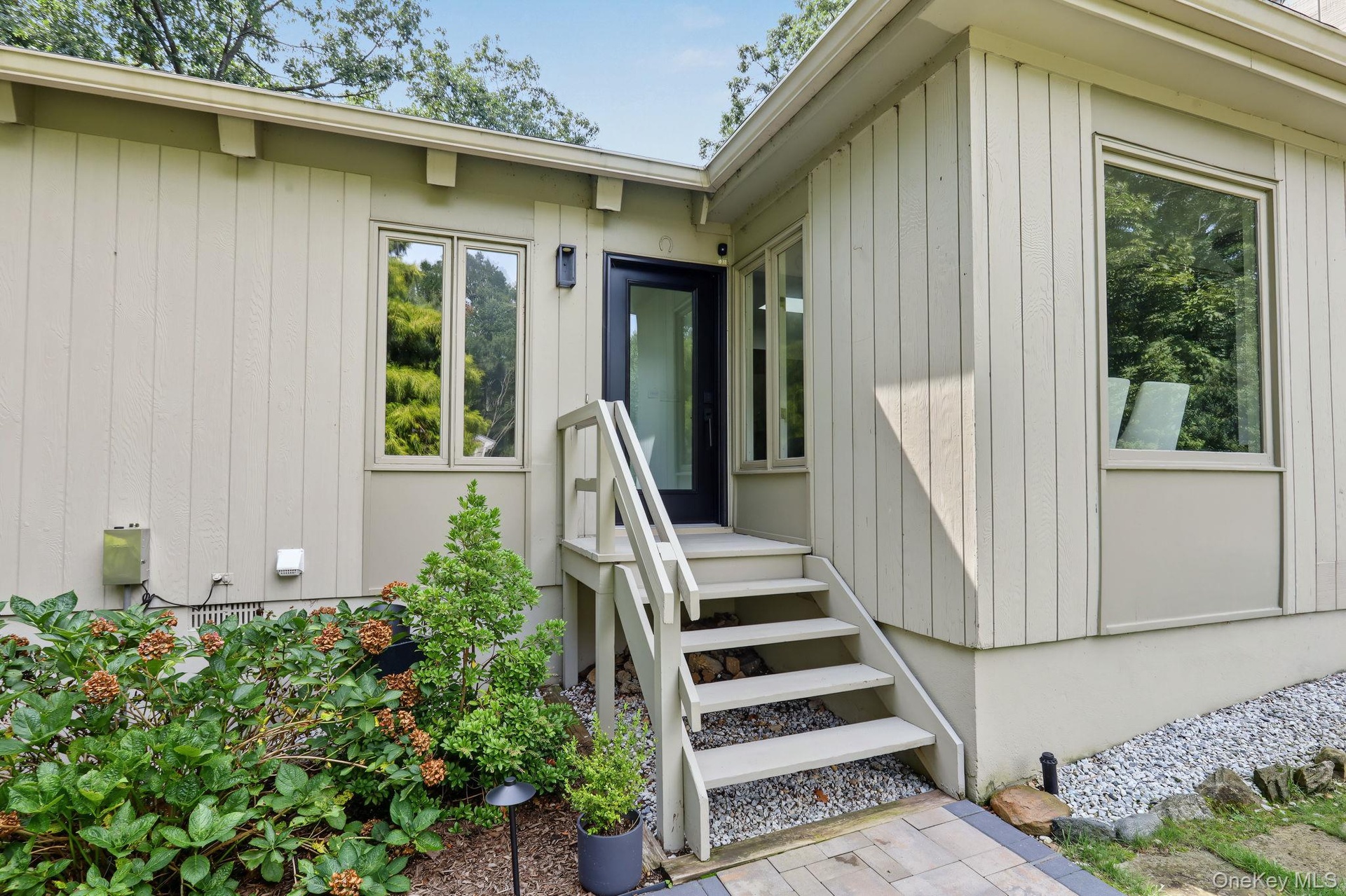 Side entry with brand new walkway and railing.