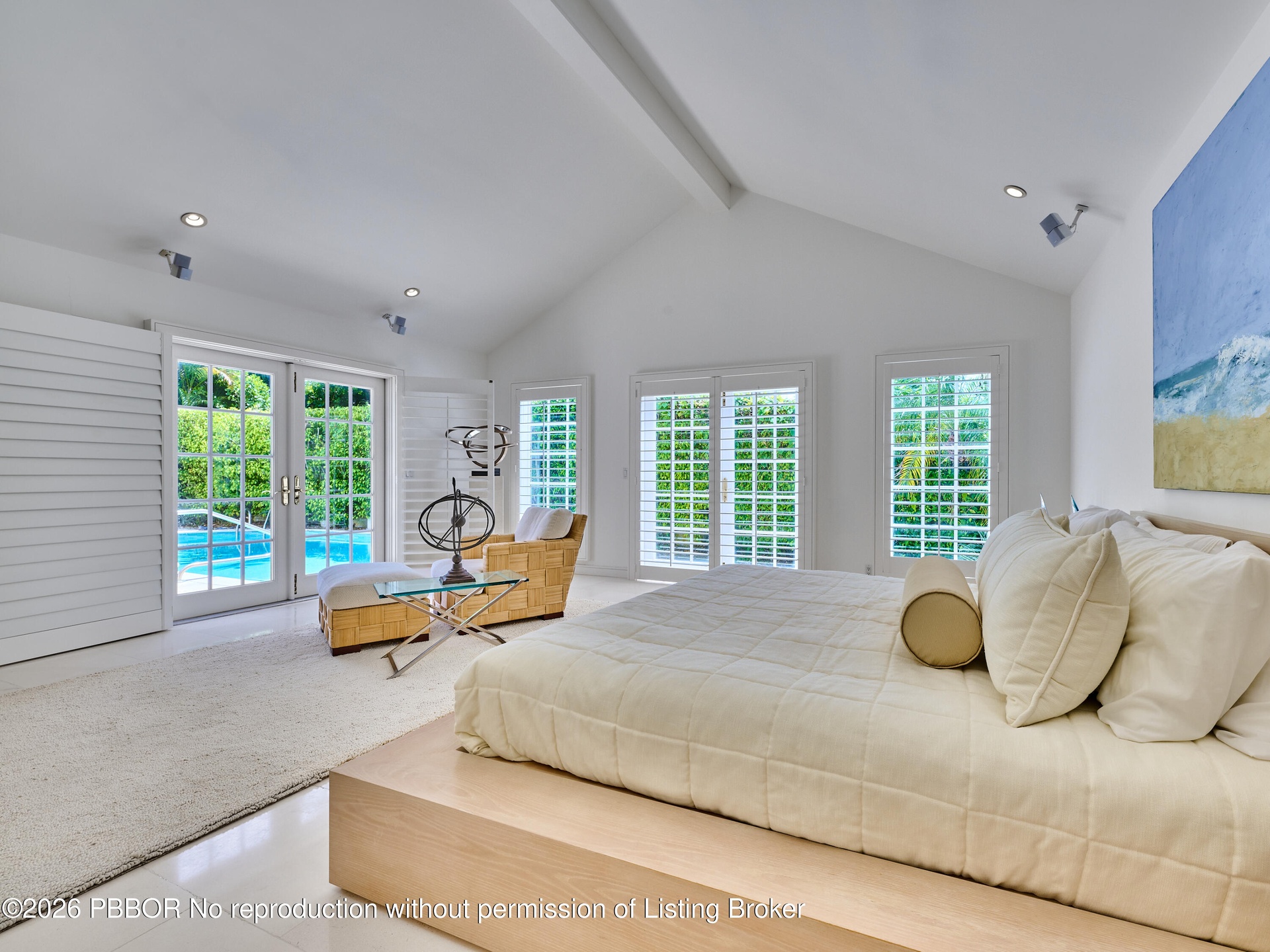 Walls of French doors fill the space with natural light