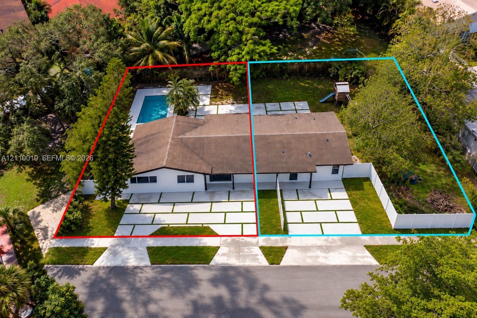 Aerial perspective of two properties featuring concrete paver driveways with grass inlay, rectangular in-ground pool, white vinyl fencing, and mature 