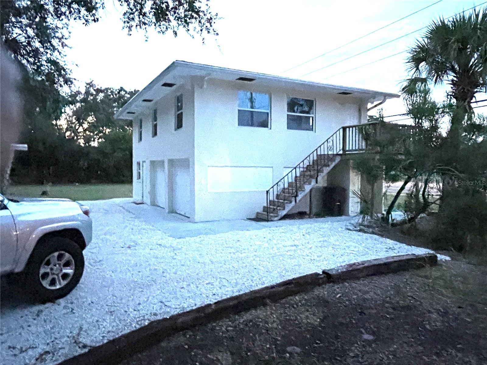 Parking area and house