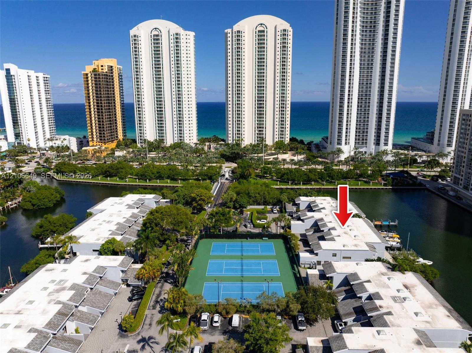 Waterfront residential community featuring three hard-surface tennis courts and immediate canal access