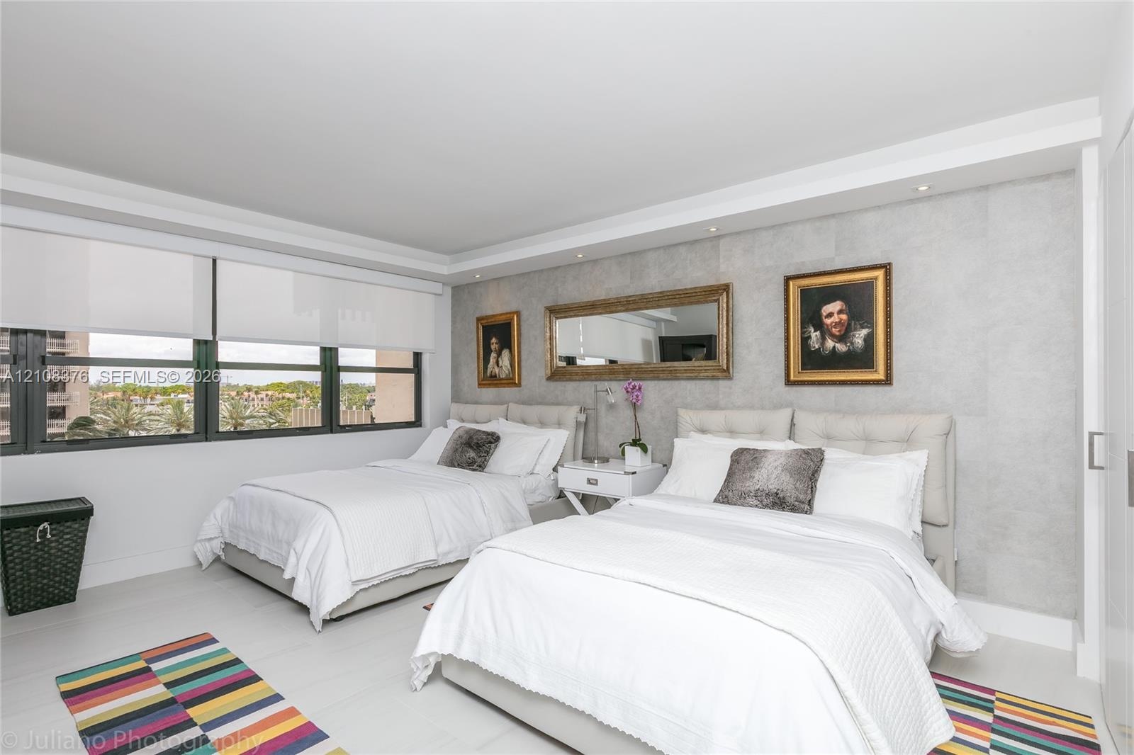 Second Bedroom with two full beds, offers beautiful ocean view