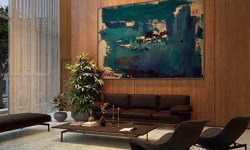 Double-height space featuring floor-to-ceiling windows and wood-paneled walls