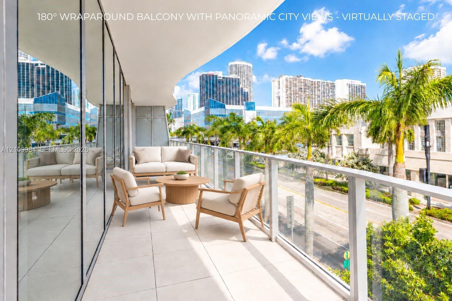 Wraparound balcony featuring large-format tile flooring and floor-to-ceiling glass panel railings