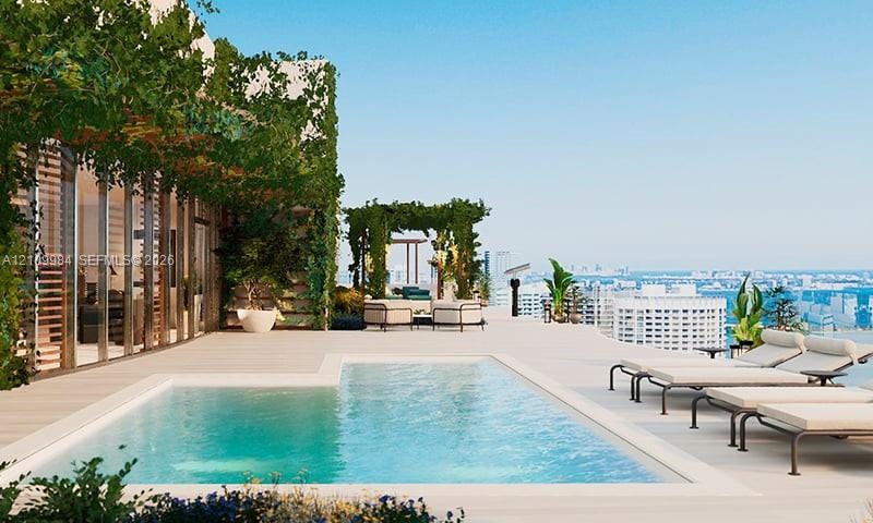 Rooftop terrace featuring a rectangular swimming pool, integrated landscaping, stone-finish flooring, and a shaded pergola structure