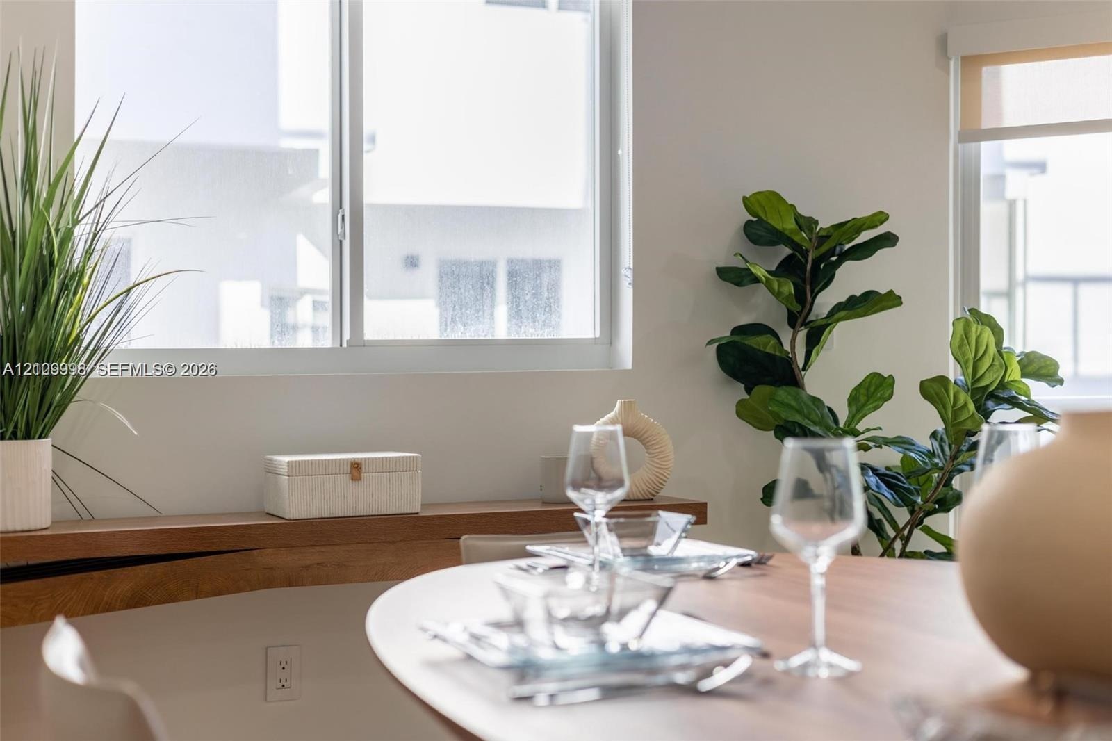 Horizontal sliding windows, built-in wood-finish shelving, and integrated roller shades