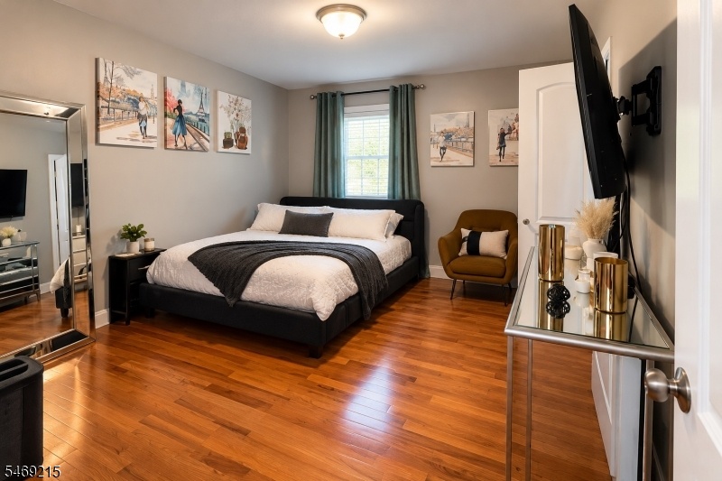1st fl Bedroom w/ teal curtain
