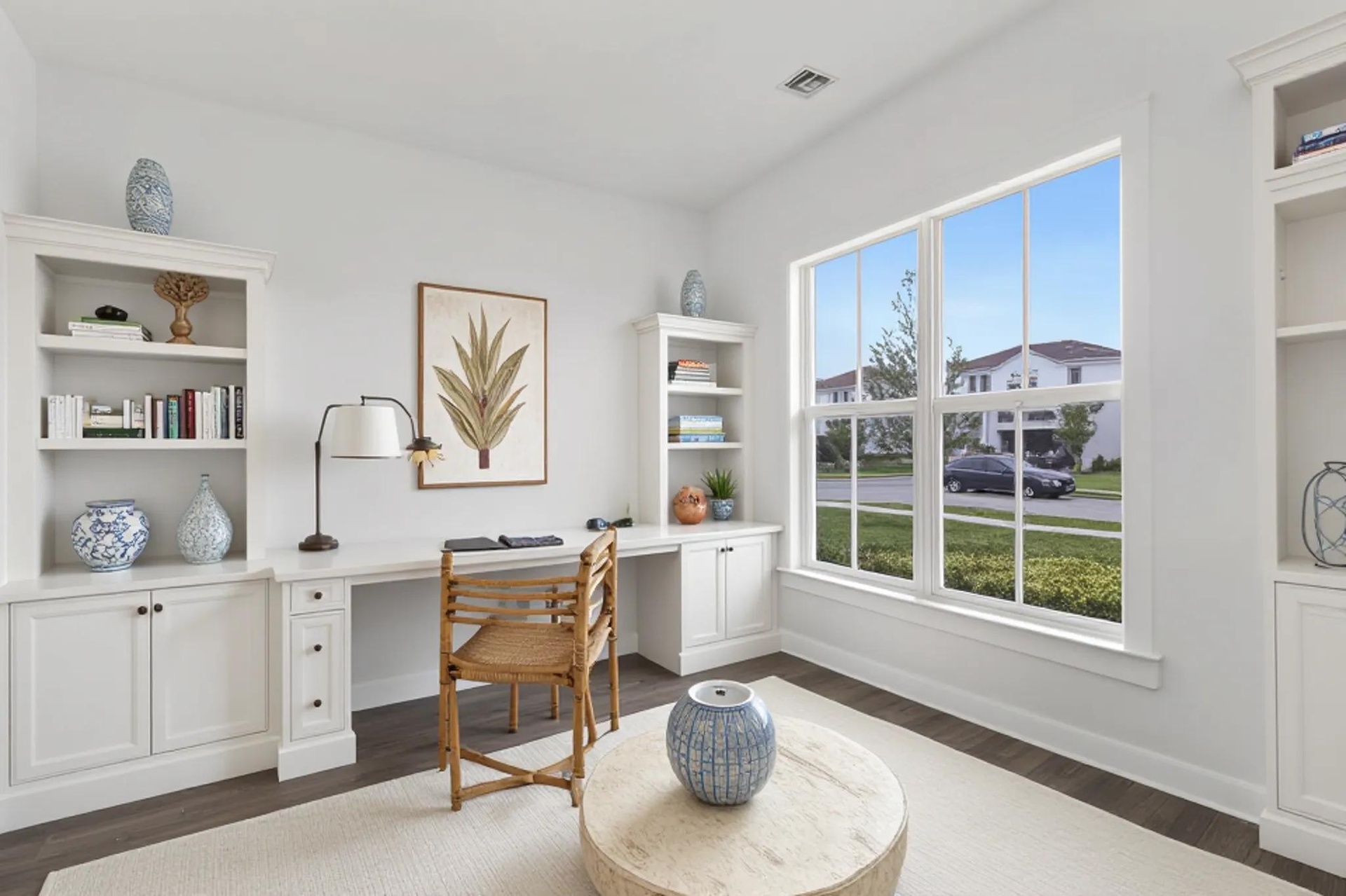 A versatile den or home office featuring beautiful natural light and pleasant outdoor views, creating a bright and inviting space.
