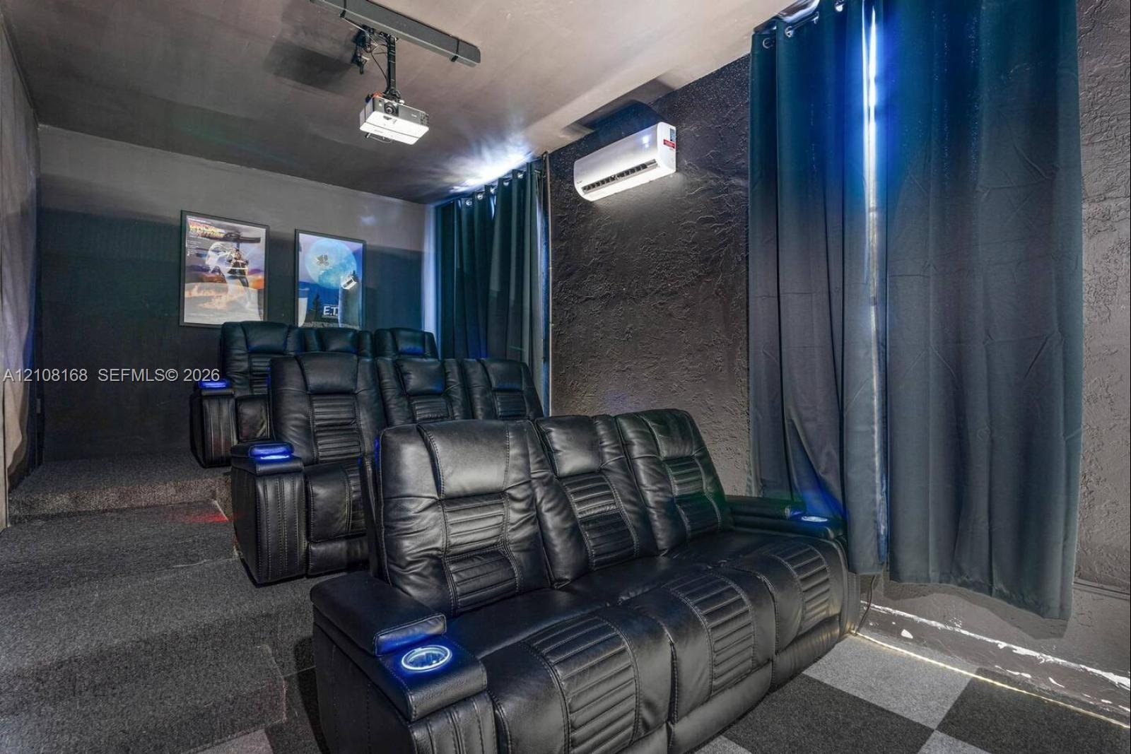 Multi-level tiered platform flooring, dedicated ceiling-mounted projection system, and wall-mounted climate control unit