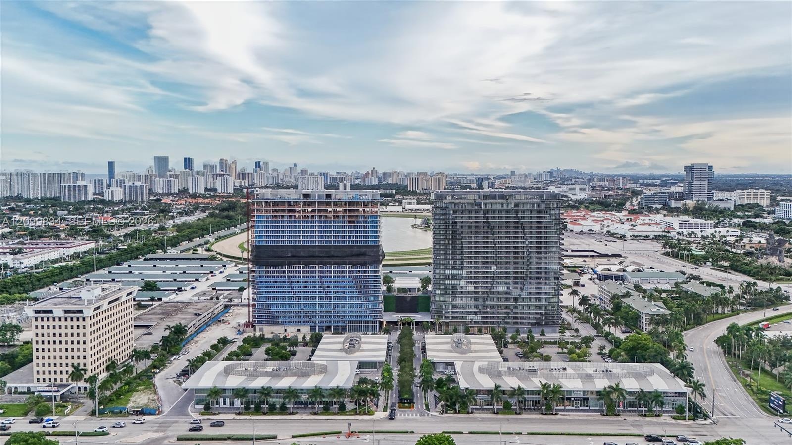 Aerial perspective of high-rise structures featuring glass-paneled facades and architectural exterior design