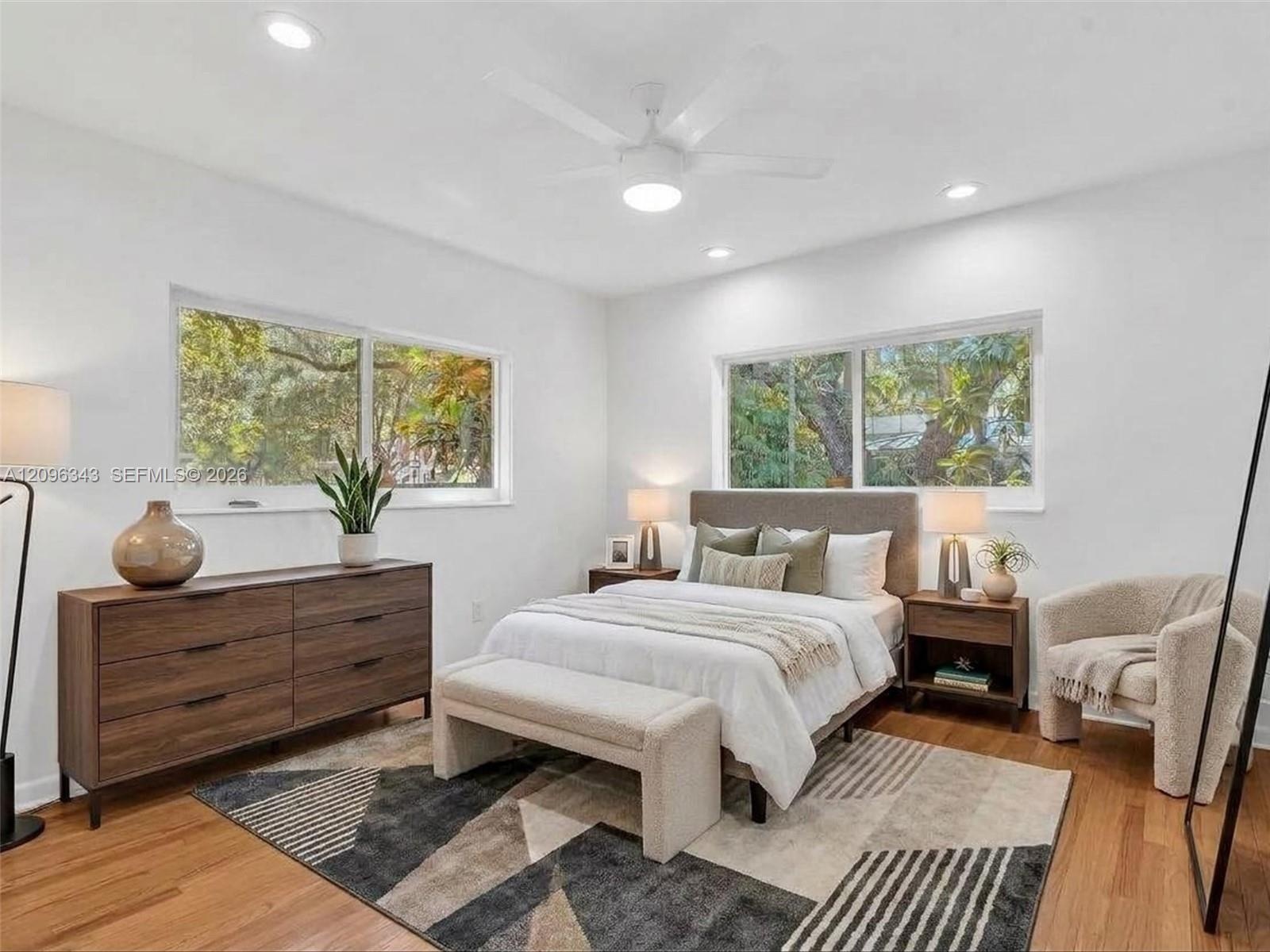 VIRTUALLY STAGED. Sunny and private back bedroom overlooking gated yard with double closet. House for rent in Coconut Grove.