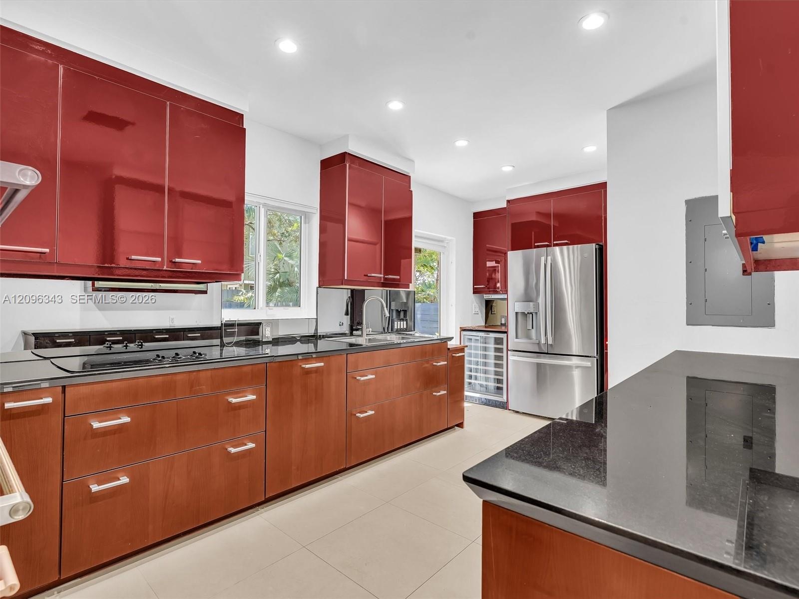 Stylish Poggenpohl kitchen with stainless steel appliances in home for rent in Coconut Grove in Miami, FL. Updated rental in Natoma Manors has 24/7 po