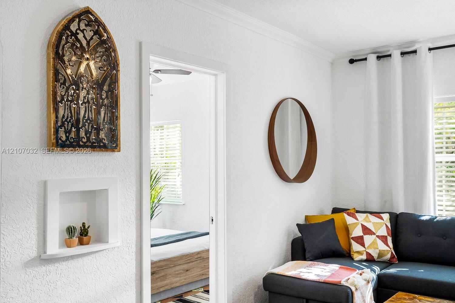Recessed wall niche and white crown molding