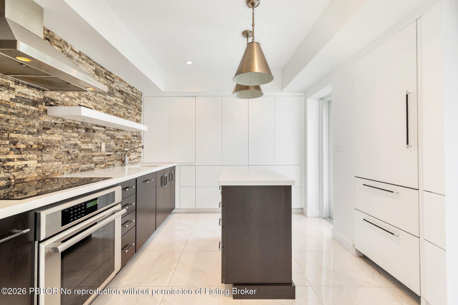 Sleek custom Kitchen with a service entrance door
