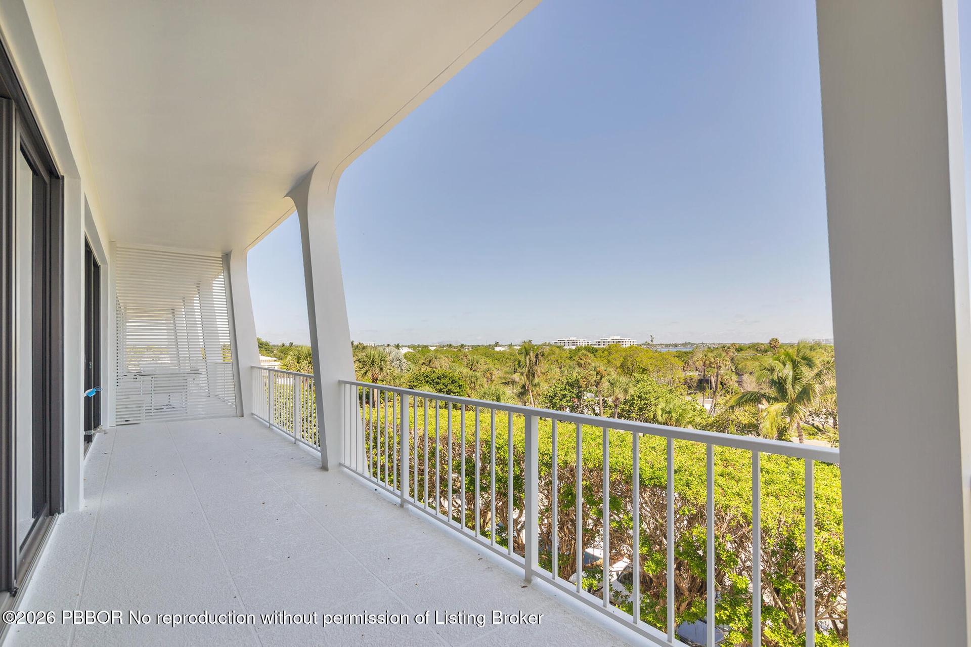 Expansive covered balcony spans the width of the living area and bedrooms