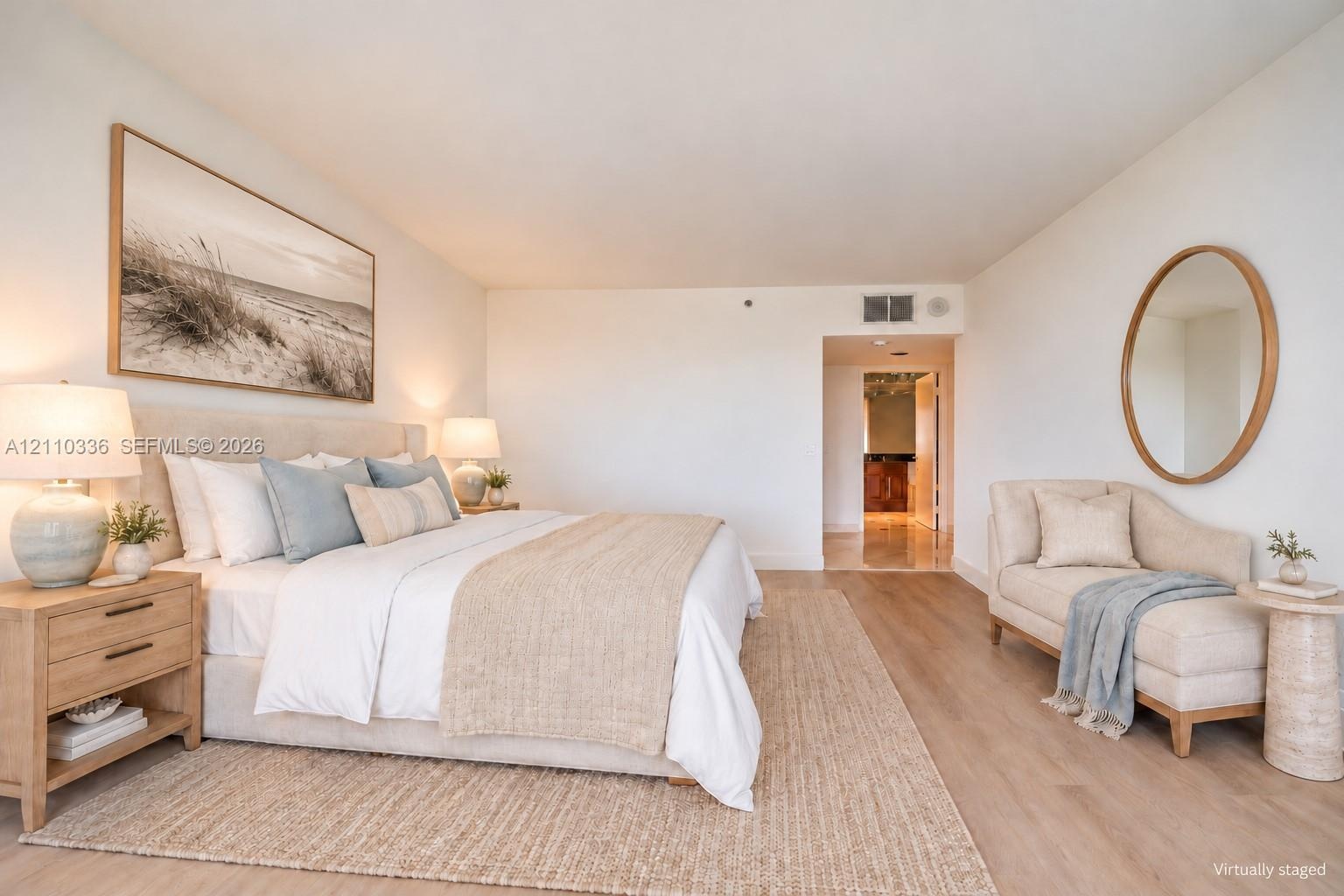 Light-filled interior featuring wide-plank wood-finish flooring and smooth finish walls