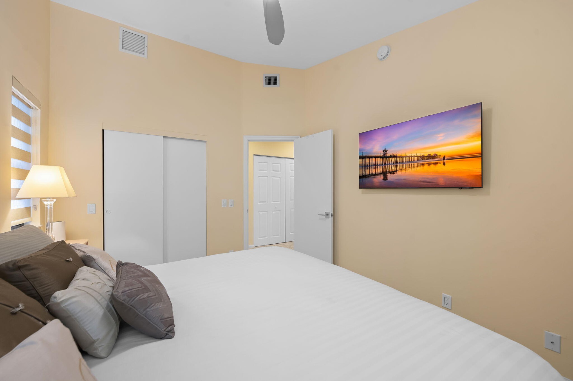Vaulted ceilings, sliding closet doors, and multi-layered window shades
