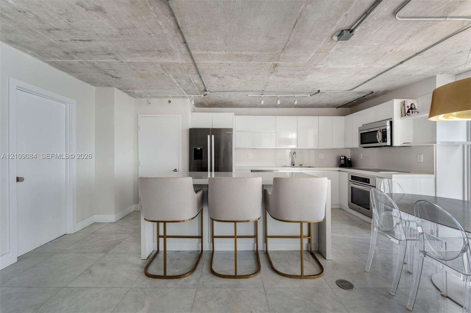 Direct oceanfront access featuring a sandy shoreline and expansive water horizon