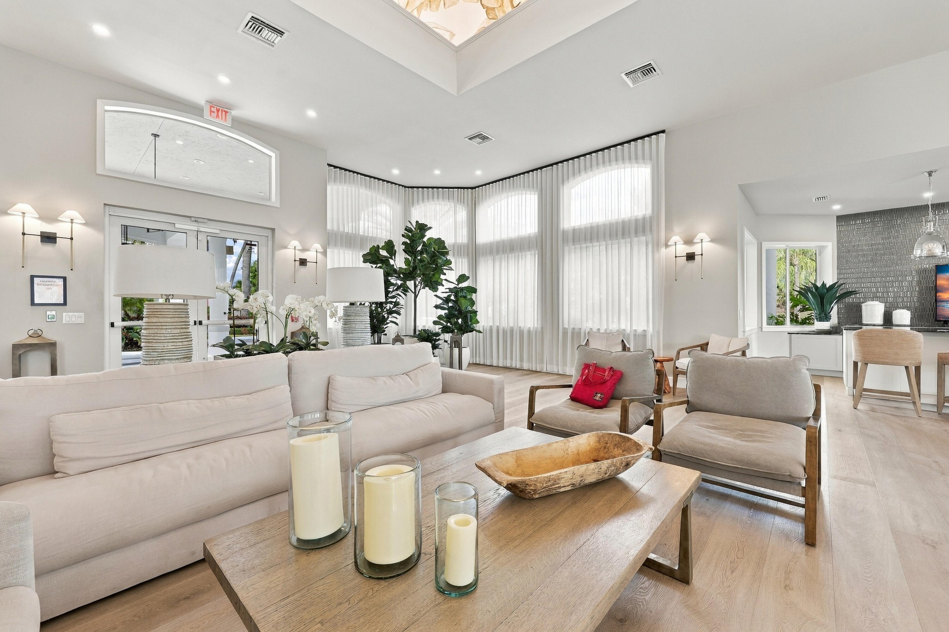 The beautifully appointed clubhouse offers an inviting gathering space with comfortable seating, soaring ceilings, and an elegant atmosphere for resid
