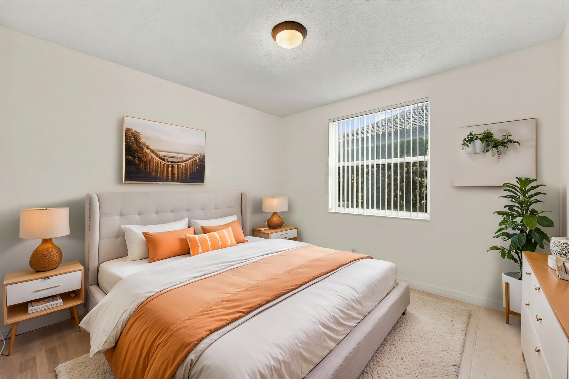 This well-appointed main-level bedroom offers flexibility for guests, a private office, or additional living space, with convenient access to the home