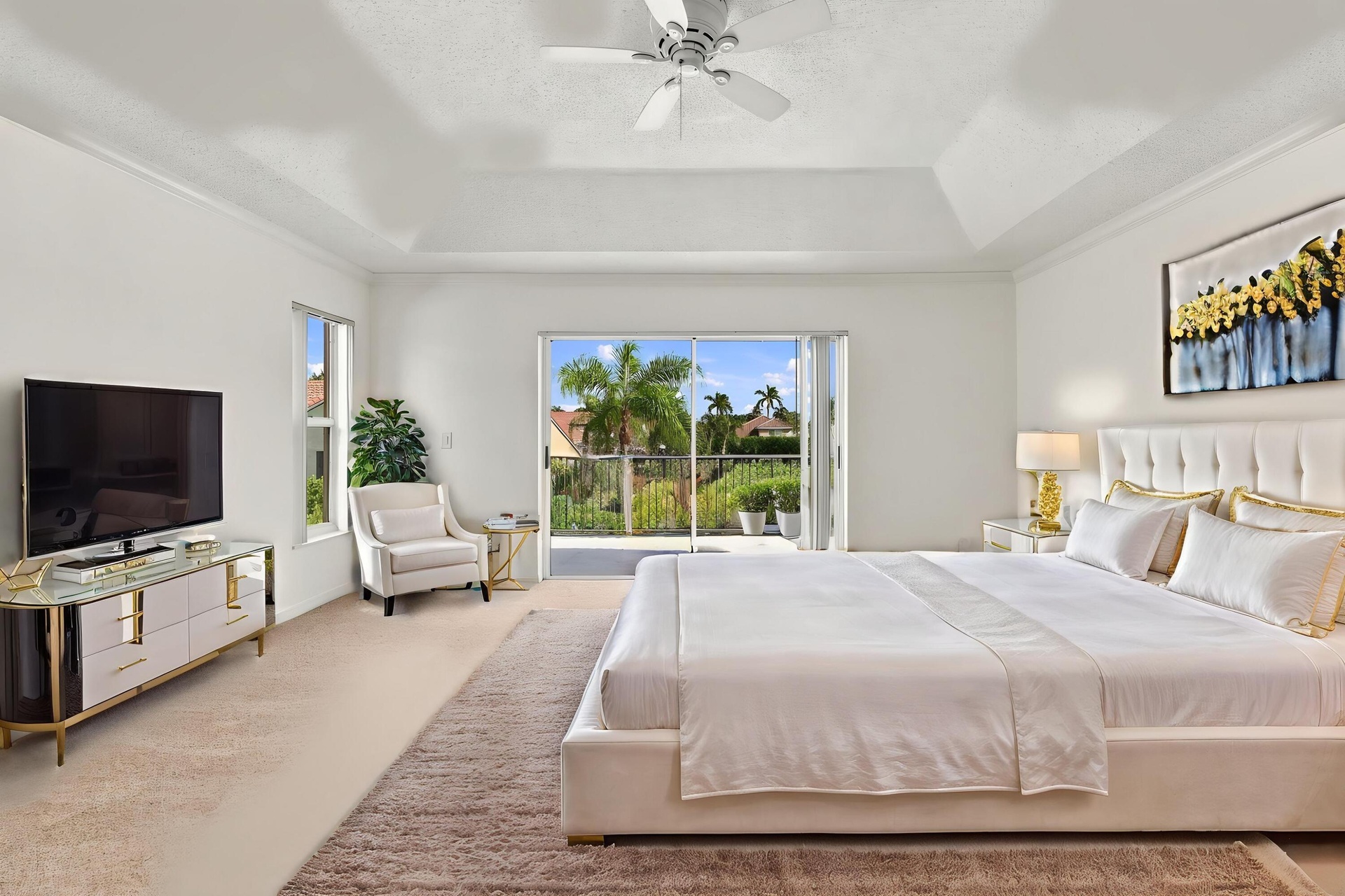 Wake up to beautiful waterfront views! Sliding glass doors open directly onto a private second-story balcony overlooking the tranquil lake and tropica