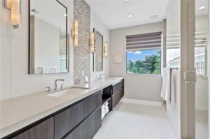 En Suite Primary Bathroom #1 with Double Sink & Shower.