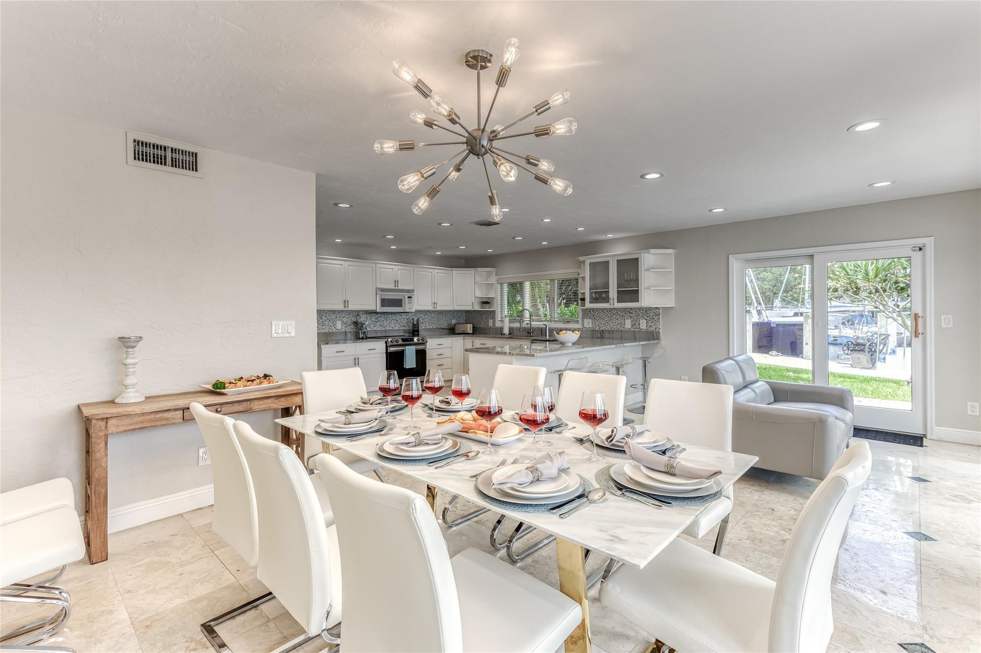 Dining Room Seating for 8 of Kitchen overlooking pool & waterway.