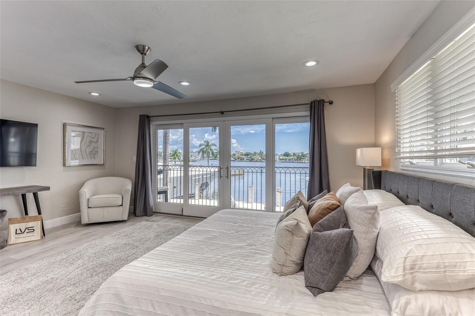 BEDROOM #2 (Upstairs) KING Size with balcony overlooking waterway with en suite bathroom, shower, smart TV